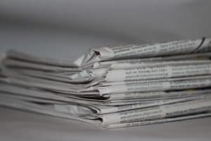 stack of folded newspapers