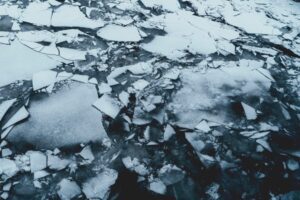 shattered glass on asphalt