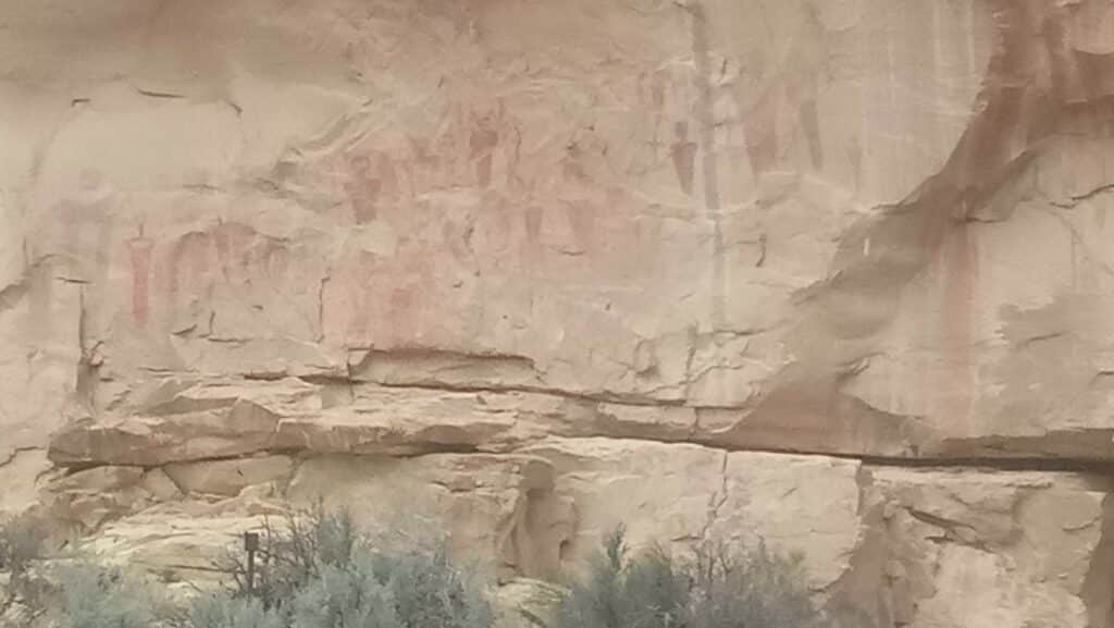 red heiroglyphs on rock in Arches Canyon UT